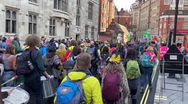 Extinction Rebellion throw thousands of origami paper boats outside the Home Office in support of migrants