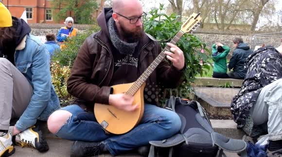 Xr people assemblies  take a lunch break too the sounds of a  balalaika mandolin , from OVO London uk.
