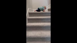 Adorable toddler masters the art of walking down stairs