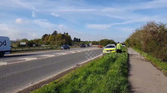 Police car hitsa man hole cover sticking up in a live lane of the A12 in Kelvedon causing long delays