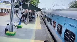 Chilling moment man gets dragged by moving train after he slips while trying to board it in eastern India