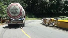 trucks and buses meet at extreme bends
