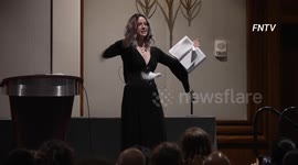 Crowds cheers as woman tears apart Bible during SatanCon held in Boston