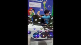 Ayyan Mohsin and Aaron Mohsin in playland enjoying play game