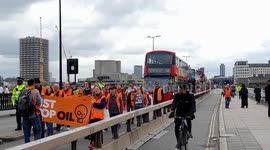 Just Stop Oil obstruct traffic on Waterloo Bridge in London on Bank Holiday Monday