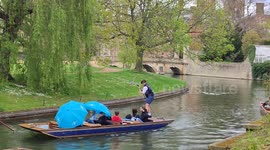 Rain hits tourists boating on the River Cam in Cambridge as bank holiday weather turns
