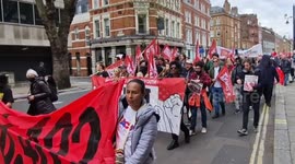 May Day workers' solidarity marchers sing anti-royalist slogans in London