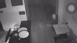 Brazen burglar creeping around a café before digging tunnel into Rolex shop next door