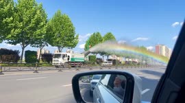 Vibrant rainbow appears as fogger truck combats air pollution in China