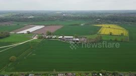 4K sideways flight of different types of farming fields in the Cheshire countryside