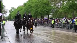 Mounted horses ride through King Charls III carriage route