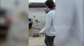 Man spotted being rescued from up to his waist in thick mud on Kent coast