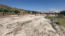 Palestinians gather near the damage of Jibb Al-Deeb School demolished by Israeli authorities in the small Palestinian village of Bayt Ta’mar, to the east of Bethlehem in the south of the West Bank