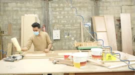 Palestinian carpenters work inside a furniture factory in Gaza city