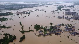 Rescuers save residents trapped in flooded houses in southeastern China