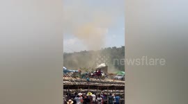 Dust devil tornado whips through festival in Thailand