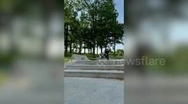 Skater lands painfully on his bottom while trying 360 flip down stair set
