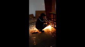 The video begins with a close-up shot of a man holding a power tool in his hand, with sparks flying out as he starts cutting into a large piece of iron. The camera then switches to a slow-motion shot, capturing the intricate details of the metal-cutting p