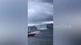 Terrifying waterspout whirls close to fishing boats in the Philippines