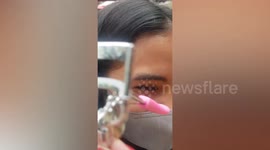 Woman has amusing eyelash extension fail while doing makeup