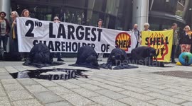 Environmental activists stage fossil fuel protest in the City of London on day of Shell AGM