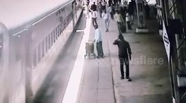 Alert cop saves woman after she loses balance while boarding moving train in central India