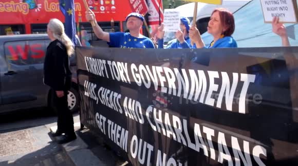 why why why Suella ? home office toxic attitude given a earbug , Sodem  protest, Whitehall London uk