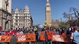 Just Stop Oil supporters protest as they continue their slow march on Parliament Square, London