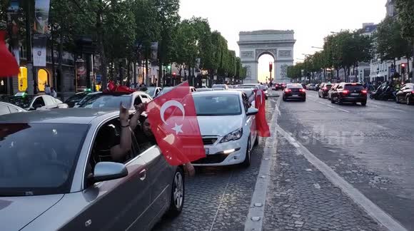 Turks celebrate along Champs-Elysees as Erdogan wins presidency election