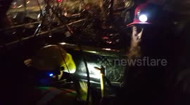 Truck flipped into ditch - cab submerged -man and dog trapped and filling up with water