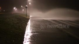 Storm Imogen -Waves blown across road Stokes bay evening.