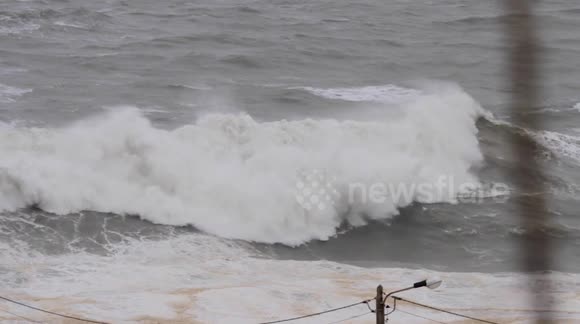 Australian surfer rides monster waves during storm