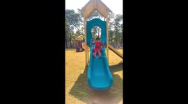 a little cute  girl pay in the sports complex with her uncel .