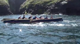 Gig racing at Boscastle regatta at the end of may, two gigs close up going left to right and then a quick pan round the crowd