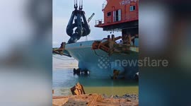 Police raid Chinese ship carrying 'ordnance stolen from British war graves' in Malaysia