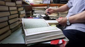 Palestinian man Hisham Barzak, 68, repairs and maintain the Holy Qur'an in a mosque in Gaza City