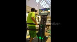 HILARIOUS video footage has emerged that shows a guy completely freaking out in a public mall as he tries a virtual reality headset for the first time.