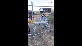 Girl trying to climb over a fence kicks her bestie hard on face in the process