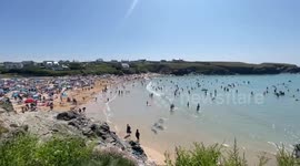 Packed Cornish beach as brits have half term fun in the sun at Treyarnon Bay