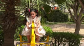 Palestinian children play on the International Day of Innocent Children Victims of Aggression at a park in Gaza City.