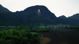 Magical moment beam of sunlight shines through mountain cave