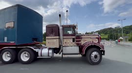 A kenworth truck giving some great sounds from the horns leaving a truck show.