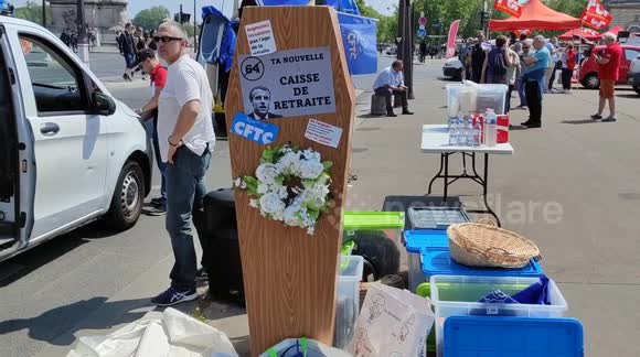 Protesters carry coffin with name of President Emmanuel Macron in Paris, France