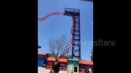 Tourists left hanging upside-down on roller coaster after power cut causes chaos at theme park in China