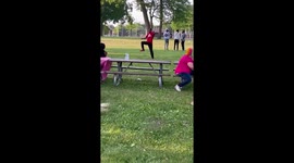 13 year old demonstrates his dance skills choreographed by himself at a park alone in front of group