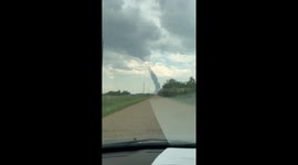 Couple Drives Toward Landspout Tornado in Alberta