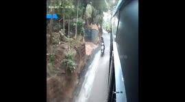 Miraculous escape for two women on scooter who got stuck between bus and van