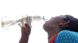 Working Peopel Drink Water Against The Sun in Dhaka, Bangladesh