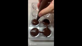 Women makes heavenly chocolate and jam-filled Bombons that look like cartoon bombs