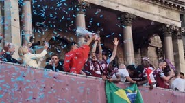 West Ham team pose with trophy in front of excited fans at Stratford after UEFA Europa Conference League win